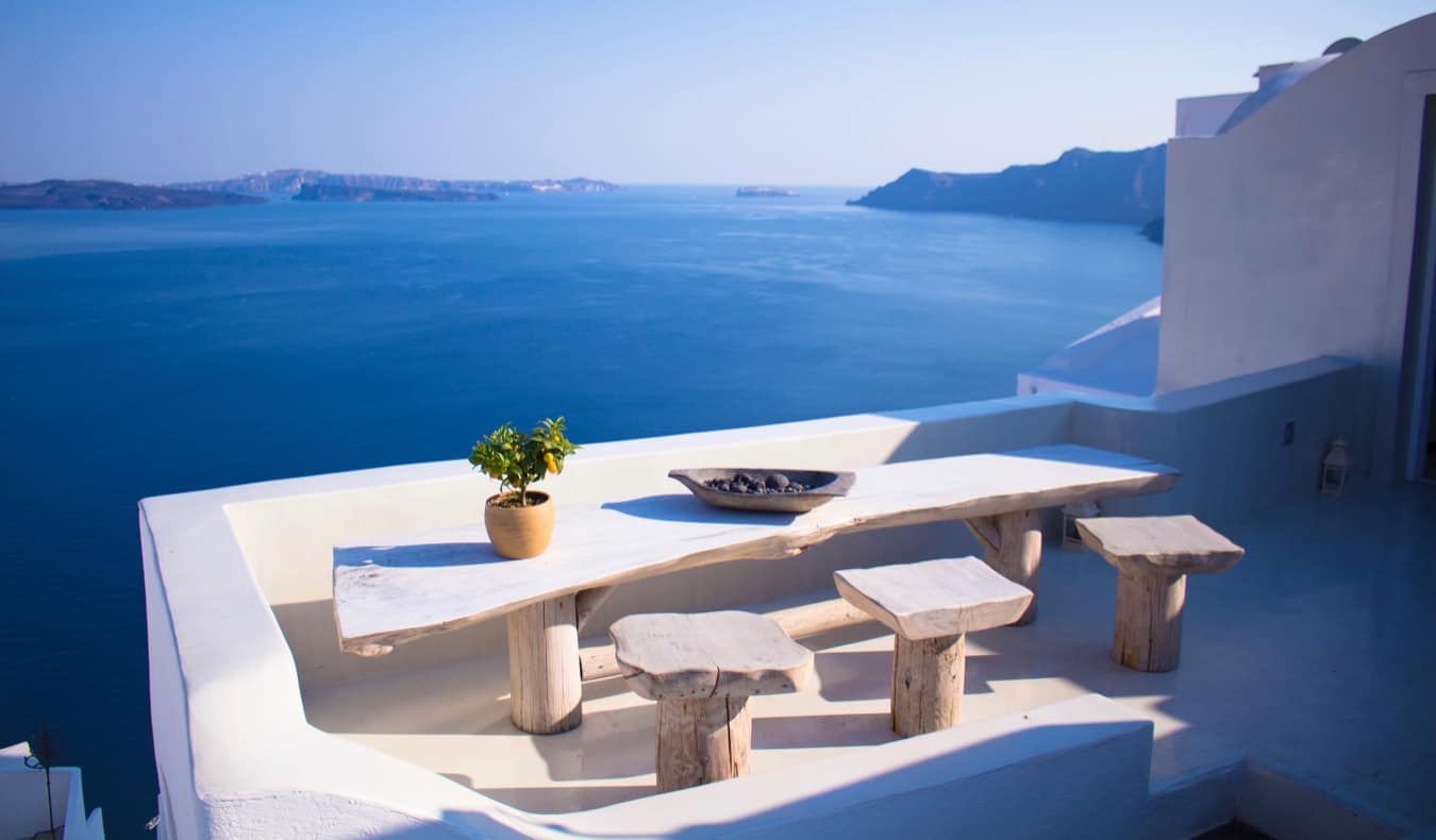 The view of the calm waters of Santorini from a charming balcony