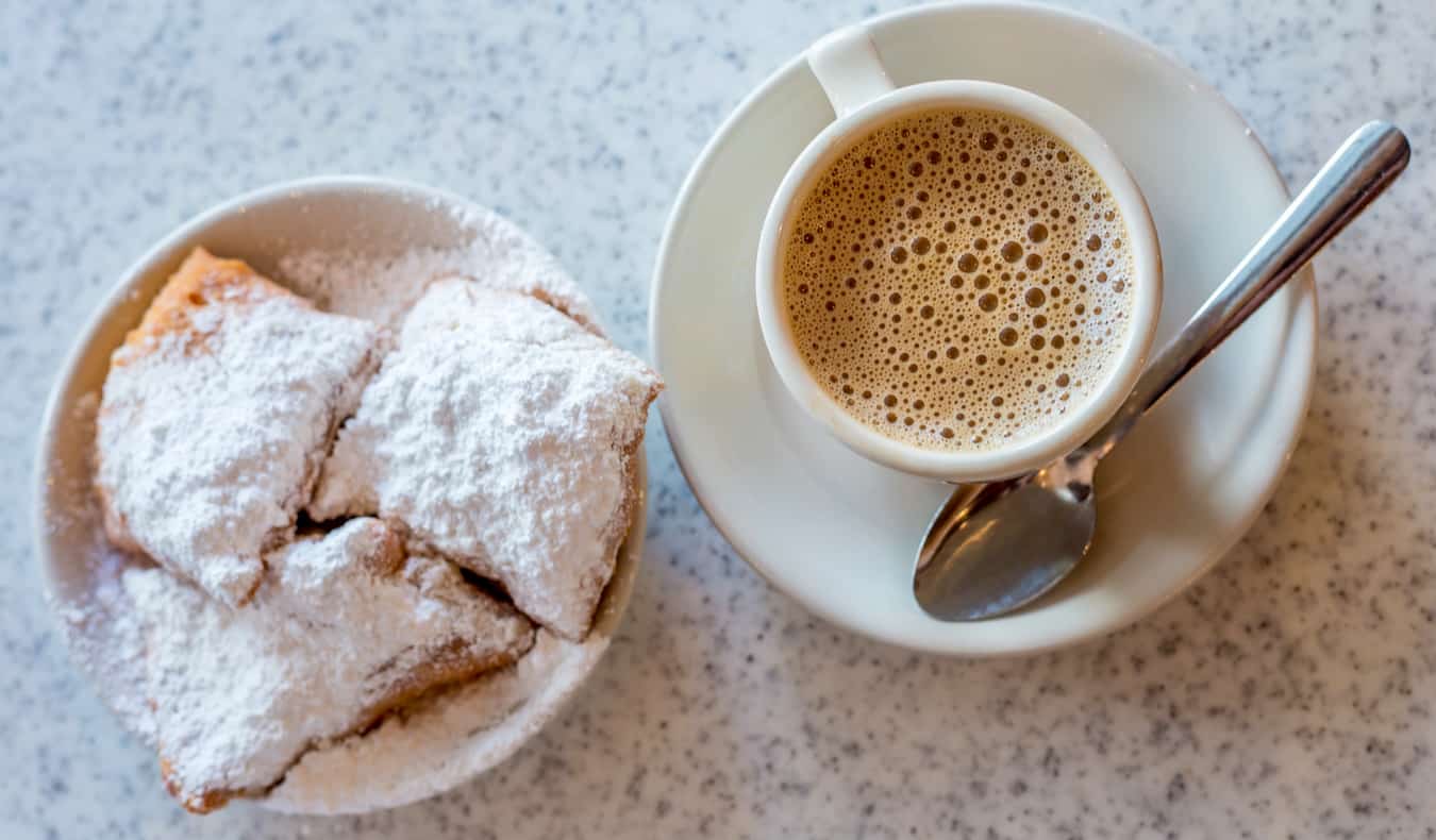A coffee and small fried snacks on a table in New Orleans, USA